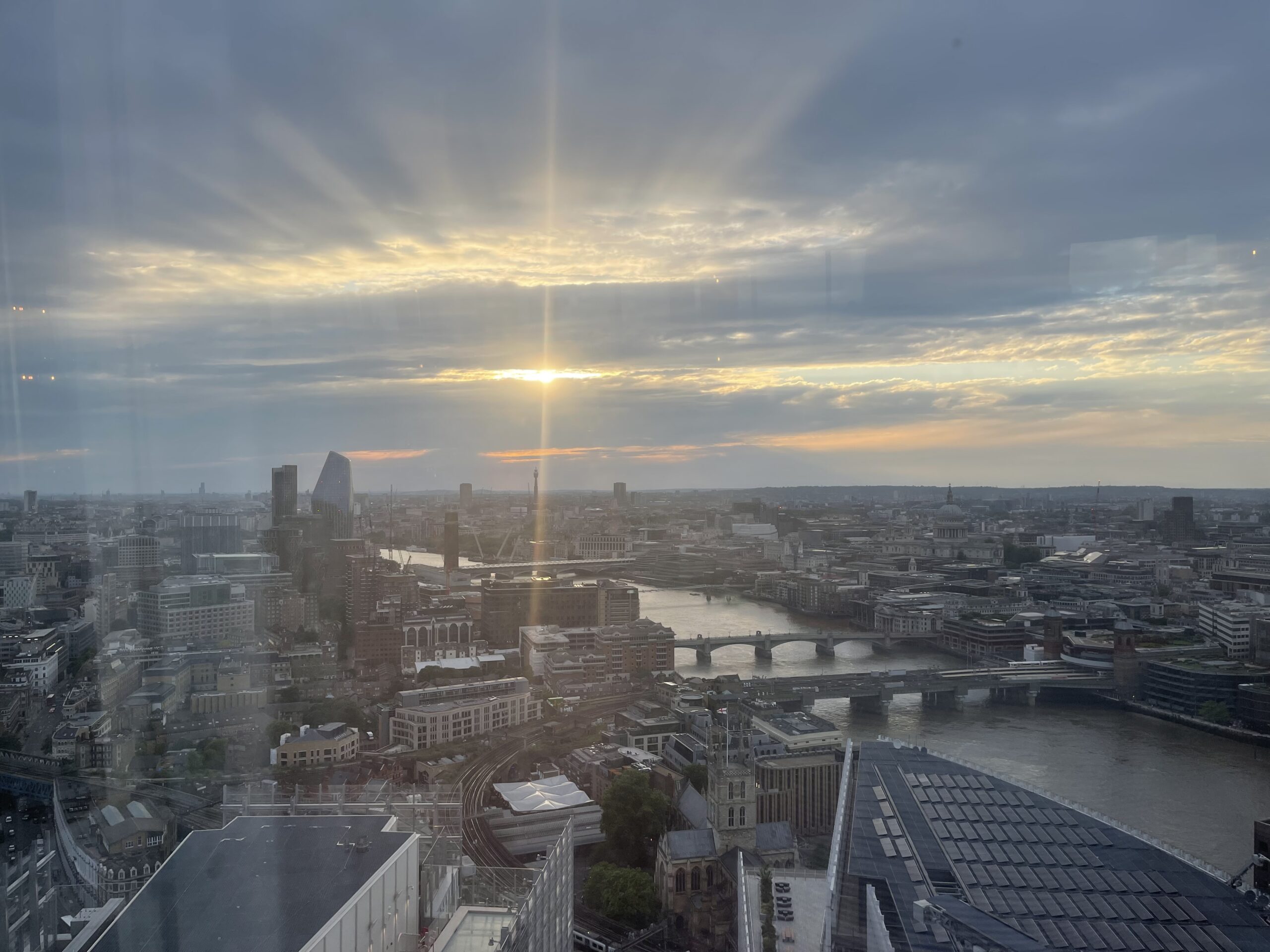 View of London skyline atop the Spire at sunset.
