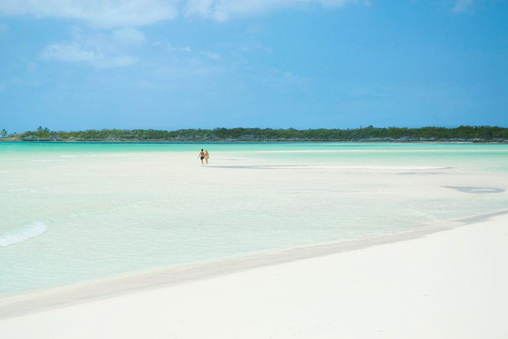 Couple walking along Ragged Island